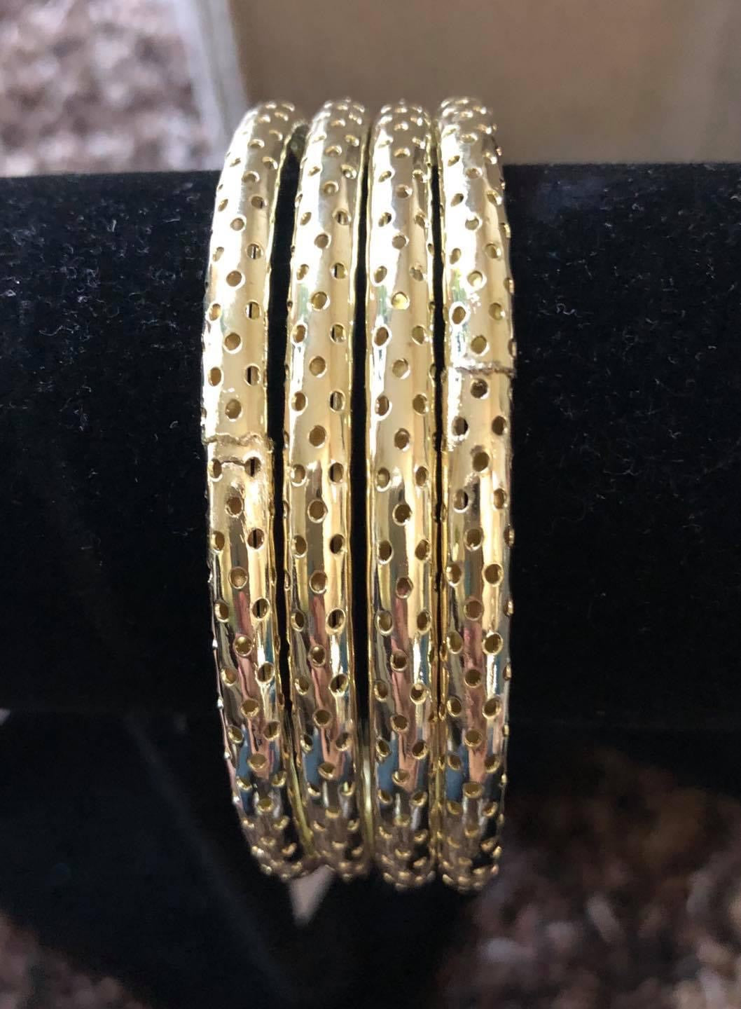 Stack Of Gold Perforated Bangle Bracelets